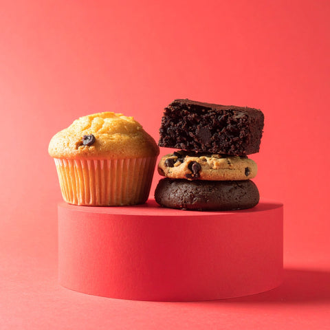Low-carb Bake Better Kit with cookies, brownies, and muffins on a red stand.