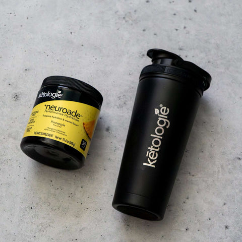 Neuroade™ Pineapple hydration mix with shaker bottle on concrete surface.