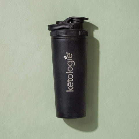 Ketologie 26oz stainless steel shaker bottle with double-wall insulation, silicone base, and spill-proof lid for blending protein shakes and keeping drinks cold