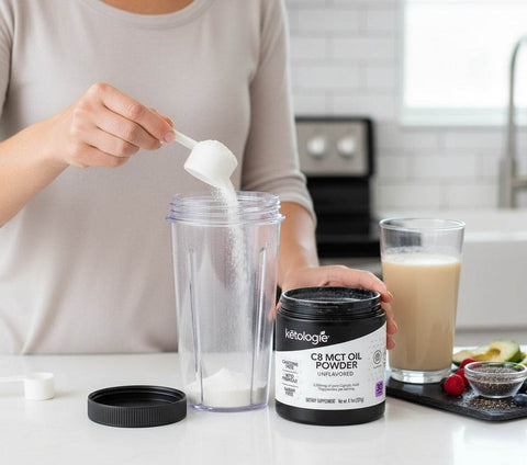 Person scooping unflavored C8 MCT Oil Powder into blender for keto smoothie preparation