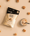 Salted Caramel Collagen Keto Shake package with glass of shake surrounded by caramel pieces, keto protein powder.